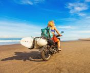 woman riding a motorcycle on a beach in sri lanka.jpg from sri lanka wife ride on hubby with clear audio mp4