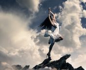 brunette girl dancing on mountain top clouds sp.jpg from cloudsexy