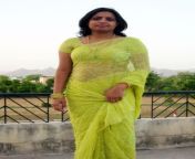 b4f4bce2784491e24bdbba7fd4d9c599 gayatri devi yellow saree.jpg from booby aunty wearing yellow sari showing hot cleavage and navel
