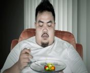 obese person depressed eating tiny portion of vegetables jpgquality86stripall from fatter