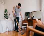 0 full length of man cleaning bedroom with vacuum cleaner.jpg from mother and son dowing sex in the ba
