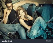stock photo sexy man and woman doing a fashion photo shoot in a professional studio retro colorized photo 117084022.jpg from bf secsi