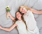 happy mother daughter lying bed with flowers 23 2148073607.jpg from mother and daughter bed naked