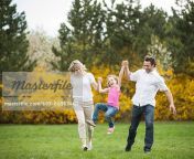 693 06967440em young couple swinging daughter between them stock photo.jpg from daughter swinger