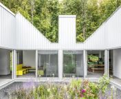 the home spreads out from a courtyard garden in a shape that resembles a hand traced on a sheet of paper the structure of each finger nods to the traditional gable sided barns that dot the area.jpg from 10 mos