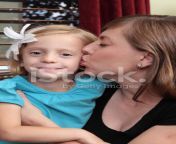 19108606 mother giving daughter a kiss.jpg from mother daughter french kiss