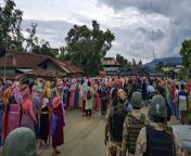 security personnel stand guard as women try to march towards tuibuong the proposed mass burial site for kuki zomi people in bishnupur manipur.jpg from manipur sex thoubal sex
