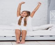 little girl stretching bedafter waking up 23 2148277135.jpg from little spreading kegs