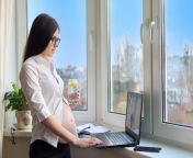 young pregnant business woman working home with laptop drinking mineral water with lemon glass window background remote work home pregnancy business 116407 13511 jpgsize626extjpg from webcam pregnant