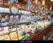 displays of parmam ham cheeses and italian food in the tamburini delicatessen in bologna italy 2ean5px.jpg from parmam