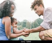 happy family holding hands together in a park outdoor mother and father with their daughter enjoying a weekend day love and happiness concept t9jrw0.jpg from pak with small biy