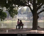 a couple sits on a bench in ramna park in dhaka bangladesh a1m3dr.jpg from bangladeshi lover romaance in park