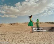 woman greeting extraterrestrial in desert landscape jpgs612x612wgik20cfy p wzm3uhkayhppmcjcbvj3ijovtfug uumsg0k48 from 230836 jpg