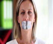 protesting woman sticks tape on mouth and is silent jpgs640x640k20c3h5efp7o20mdrz2vehpnyqbmzt5yybzuvykjw fktcy from kidnapping sex mouth tied videos 3gp king com