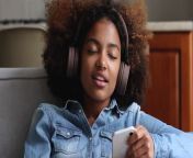 african teenage girl wear wireless headphones holds cellphone listens music jpgs640x640k20c anuuiscgatjswzd nc ihp1id qh0mvogw1qfeefqw from ebony listening