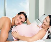 man and pregnant woman laying on bed.jpg from sex ok