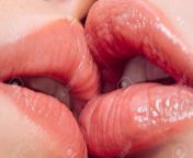 153434143 closeup of women mouths kissing and licking lips sensual kiss lip tenderness couple lgbtq.jpg from lip lock hot lip licking