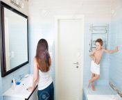 106753310 mother and child in bathroom in morning watching each other.jpg from morher son in bathroom
