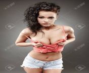 19630771 portrait of a woman squeezing her on gray background.jpg from gorgeous babe squeezing her nice firm boobs on tiktok mp4
