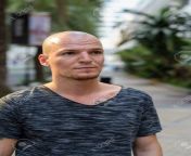 102017503 young handsome bald man thinking outdoors.jpg from young headshave