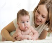 93546205 mom and her small son lying down on bed in nursery room mother embracing infant baby.jpg from smoll son and m