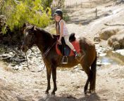 39523736 sweet beautiful young girl 7 or 8 years old riding pony horse and smiling happy wearing safety.jpg from beautiful riding 7