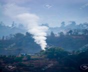 116770365 winter fire smoke in a small remote hilly village of nepal.jpg from village smoke