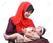 28251657 young asian muslim mother enjoying feeding her cute baby girl with a milk bottle isolated on white.jpg from muslim milk feed woman com