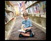 kid reading book in library.jpg from kid pay