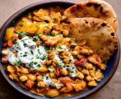 braised indian chickpea stew in bowl with naan and yogurt 1 of 1 500x500.jpg from indian bhabichut