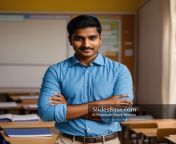 03 male indian teacher posing at classroom stock photo slidesbase com 1.jpg from indian teaches