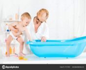 depositphotos 271572344 stock photo happy blonde mother looking baby.jpg from mom and son on bath
