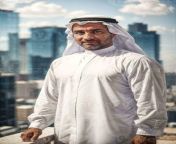 rich arab businessman in traditional white outfit in big city in background generative ai photo.jpg from arab bige