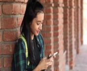 clip of a female college student typing text on her mobile phone on the college campus video.jpg from ছনিলিয়ন xa college sex video