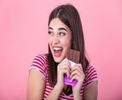 happy young beautiful lady eating chocolate and smiling girl tasting sweet chocolate young woman with natural make up having fun and eating chocolate isolated on pink background photo.jpg from chocolate lady 2021 new web series3 месяца назад