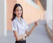asian beautiful young woman student wearing thai university student uniform is smiling and looking at camera standing to present something confidently in university background photo.jpg from thai student thai jpg