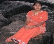 homely looking aunt taking rest at beach shores.jpg from indian aunty taking