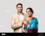 indian asian old mother and adult son in traditional wear standing isolated over white background 2cebdgt.jpg from indian old mom and son sex video comin