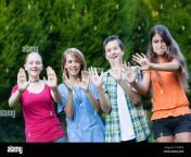three girls and one boy showing together the word teenager on their palms 2ct9ryk.jpg from 3 gril 1boy