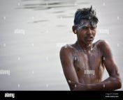 tikamgarh madhya pradesh india november 13 2019 indian village boy bathing in the river on morning washing body and hair with shampoo 2c5h8d9.jpg from indian village school nude bathing outdoor videos