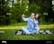 lovely couple have fun together sit on plaid outdoor enjoy sunny weather pose for making selfie at camera 2c31k21.jpg from cute couple outdoor fun
