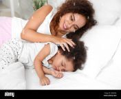 african american mother with sleeping daughter lying on bed 2bk0xxa.jpg from black and mom daughter sleep fuckingasss nayanthara romance