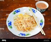 yangon myanmar june 4th 2020 myanmar traditional or classic thick round noodle salad called nan gyi thohk recipe and a cup of tea equated as a bur 2gar30g.jpg from myanmar မိုး​ဟေကို