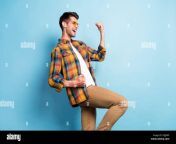 profile side view portrait of attractive cheerful lucky guy rejoicing having fun isolated over bright blue color background 2gjjxrf.jpg from lucky guy having fun with