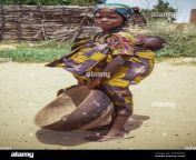 young hausa girl carrying her sibling on back dara tchama niger near zinder 2d54w32.jpg from arewa bf