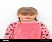 a 5 year old girl with pigtails and a blank expression on her face against a white background 2d6mmpg.jpg from little 5y o