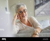 portrait of a beautiful smiling 55 year old woman with white hair 2d8r9ba.jpg from 55yer