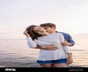young man kissing neck and hugging brunette woman near sea 2d8yphg.jpg from nude hug neck kiss images