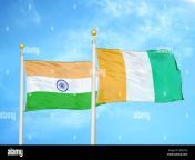india and cote divoire ivory coast two flags on flagpoles and blue cloudy sky 2djcxcg.jpg from indian cote
