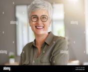 portrait of a cheerful 55 year old woman with white hair 2dkc6be.jpg from 55yer